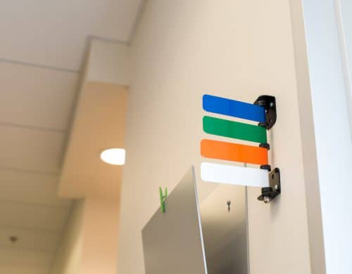 Color-coded patient status flags in a pediatric clinic in Dallas, TX.