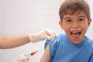 a kid getting vaccine