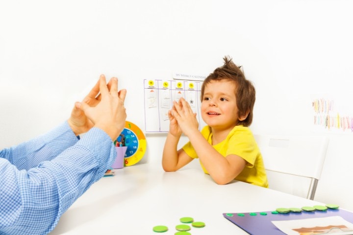 boy following therapist with hand movement