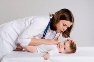 doctor checking a baby's health