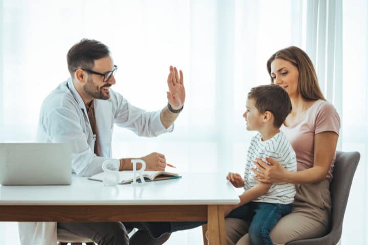 mom and boy visiting pediatrician