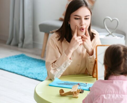 Interactive feeding therapy session with a child and therapist emphasizing oral motor skills