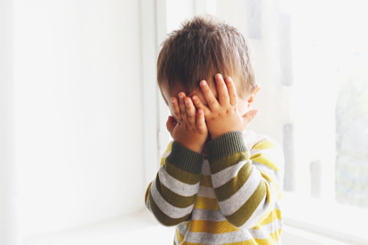 Child showing stress due to trouble expressing words