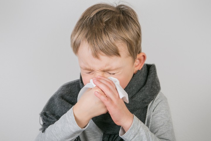 Flu prevention for kids shown by ill child in need of flu vaccination