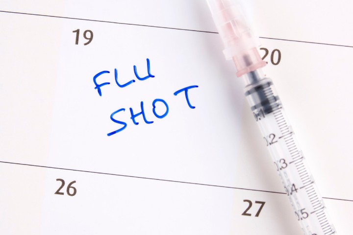 Calendar marked with flu shot appointment for children in Dallas