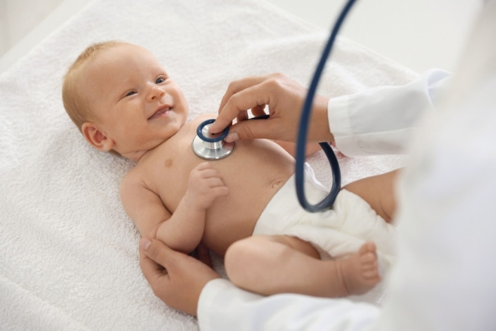 Infant receiving a routine pediatric checkup at a children’s medical clinic