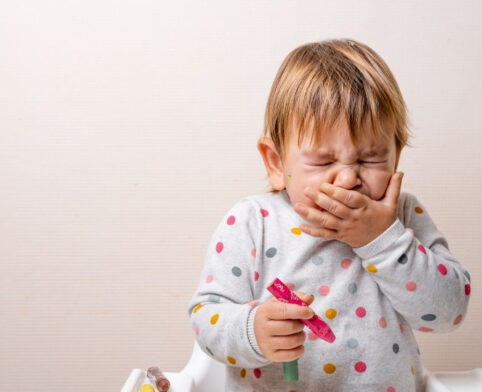 Toddler sneezing from spring allergy symptoms during Dallas pollen season