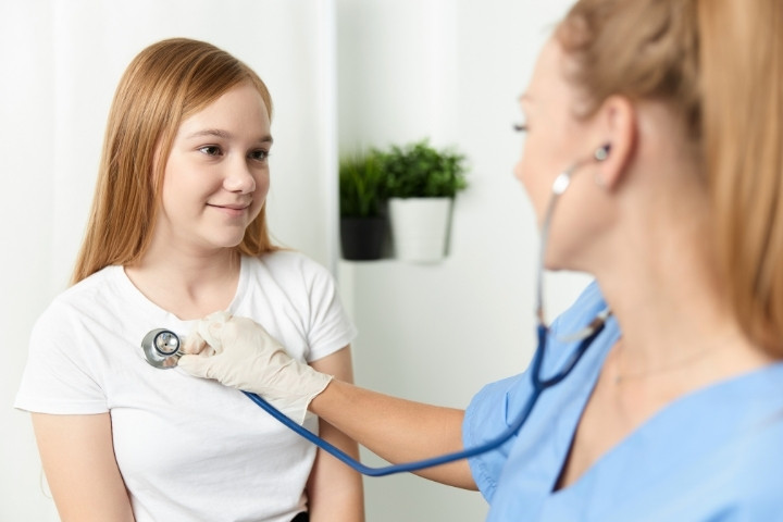Teenager at an annual pediatric wellness visit