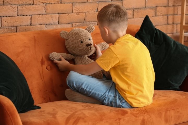 Child engaged in solitary play, a behavior that may indicate autism