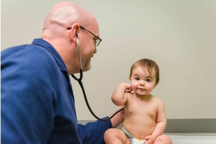 Pediatric well-child exam supporting early developmental surveillance