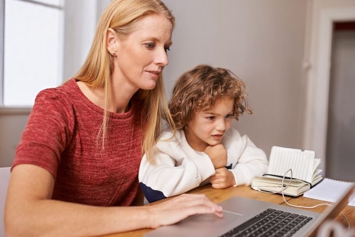 Parent researching how to care for a child’s blister after cryotherapy